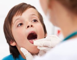 Examination of tonsils in a child